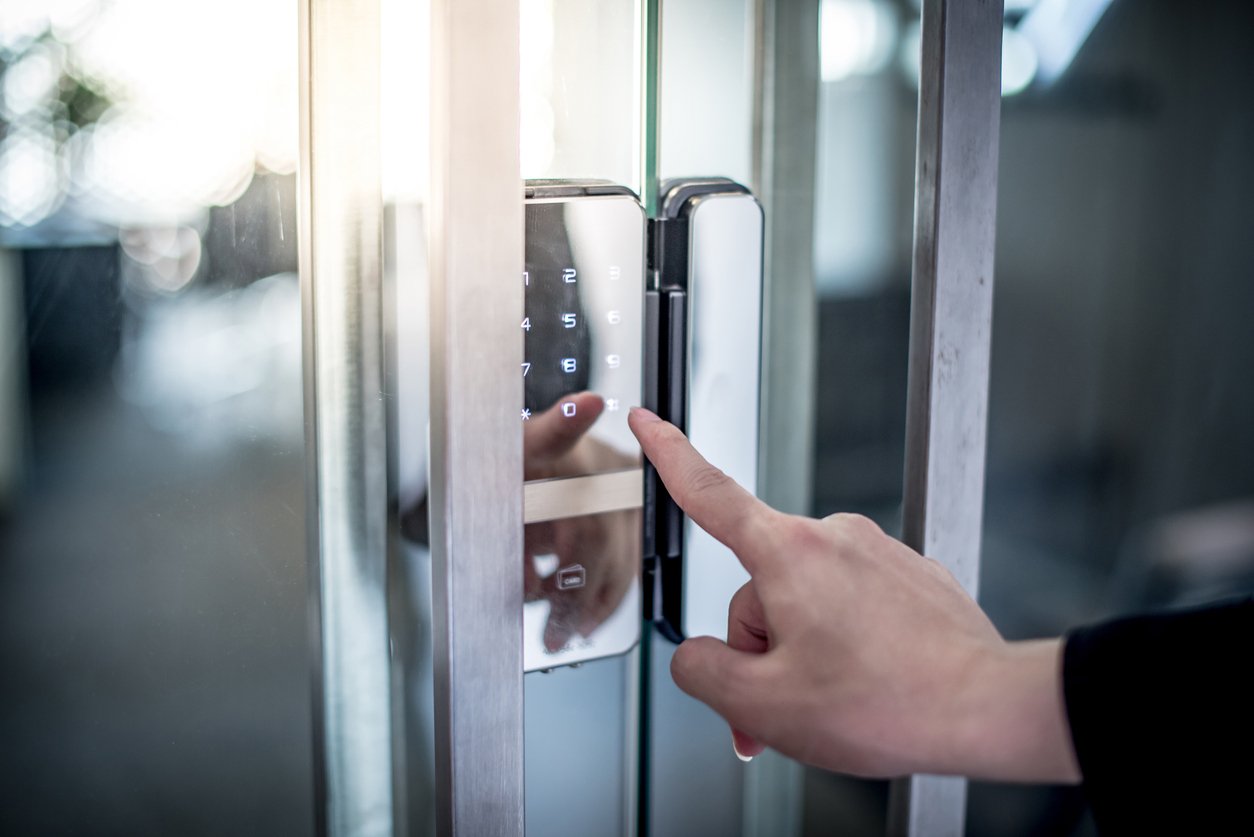 Electronic keypad access control on a glass door